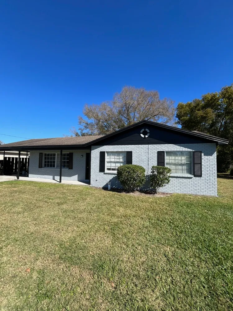 Freshly painted white home exterior with clean curb appeal