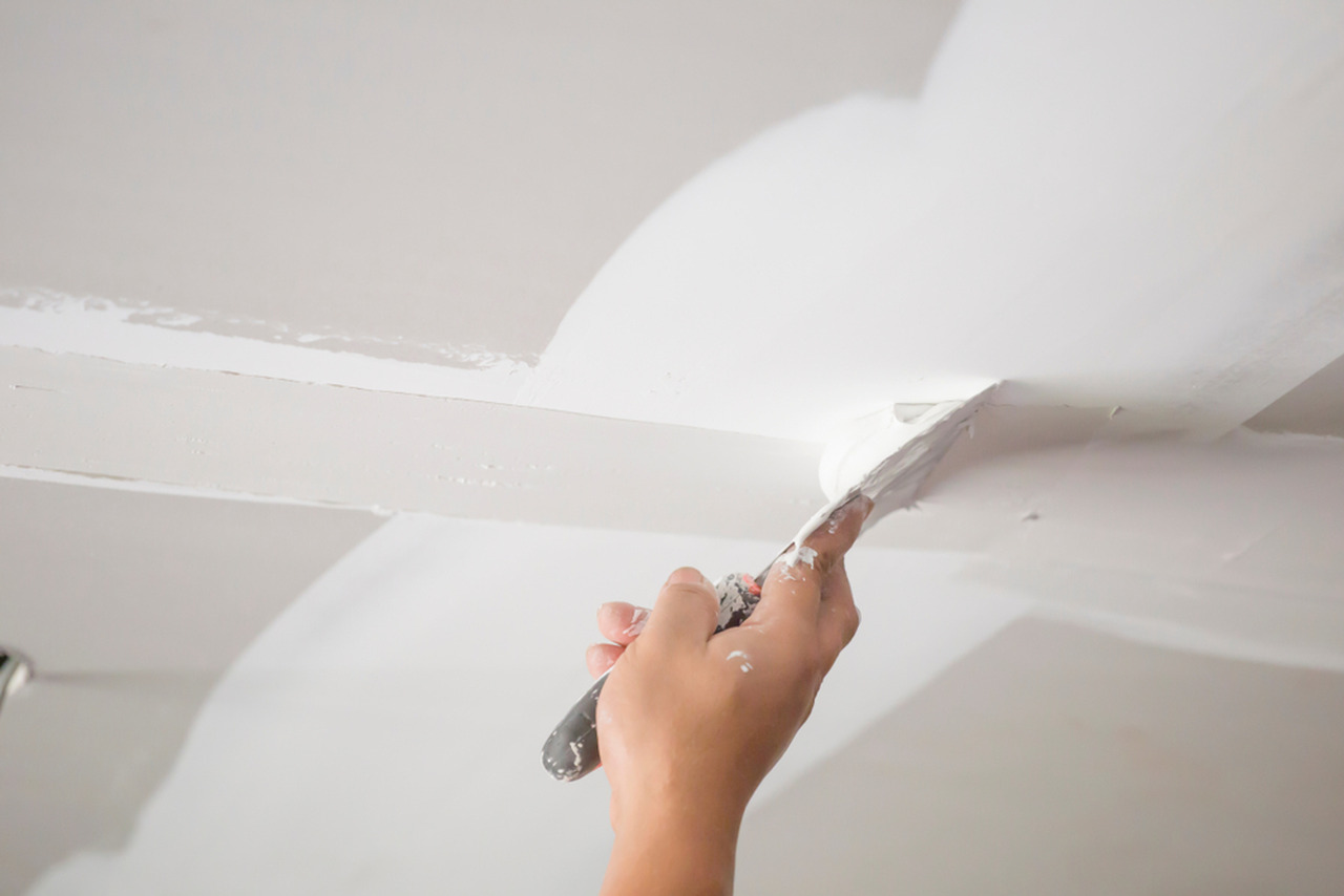 Drywall patch and surface repair before painting