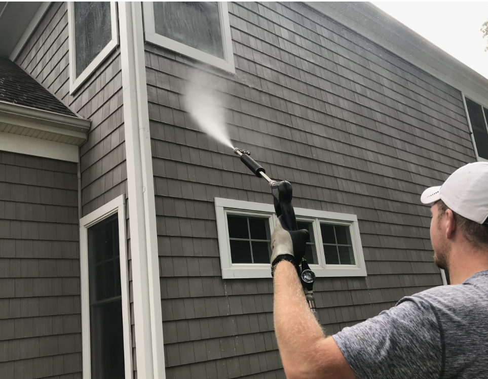 Clean home exterior siding ready for soft washing and paint prep